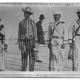 Mexican soldiers with a prisoner wearing stripes during the U.S. occupation of Veracruz, Mexico in 1914.